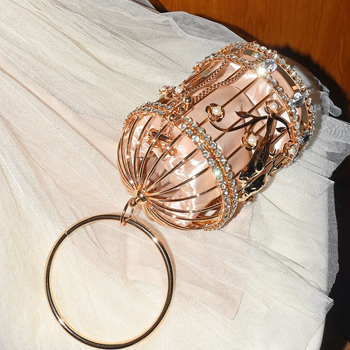 Torba u obliku ptičjeg kaveza s metalnim sjajem i ukrasom od rhinestones u obliku cvijeta, elegantna večernja torba za nošenje u ruci
