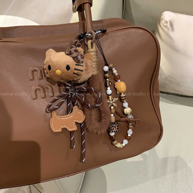 Privjesak za ključeve s leopard uzorkom, crna koža i pliš karikatura u MIU stilu