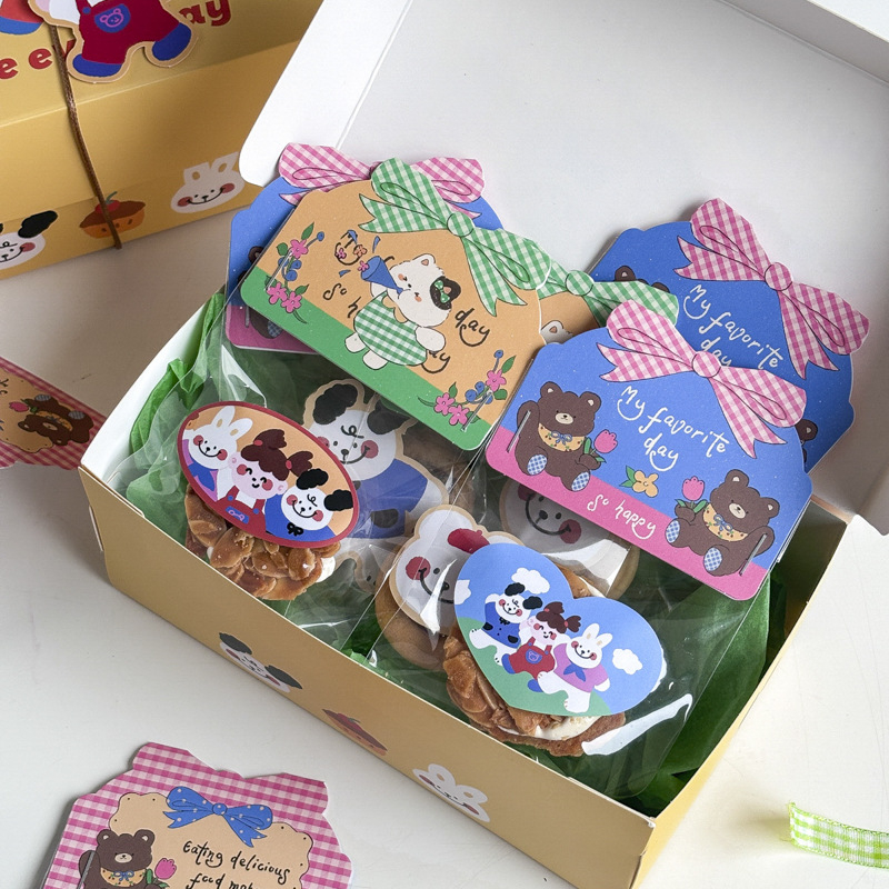 Set 30 ukrasnih topper-a za pakiranje pekarskih proizvoda — snježne pahulje i slatki crtani likovi