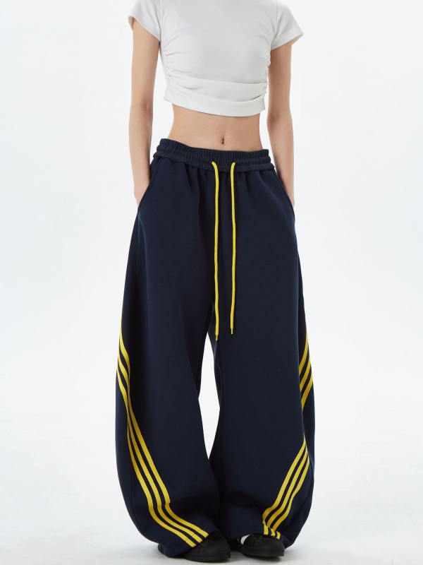 Američki gradski stil: široke sportske hlače s prugama i blokovima boja, unisex, retro dizajn, s vrpcom u struku i opuštenim krojem