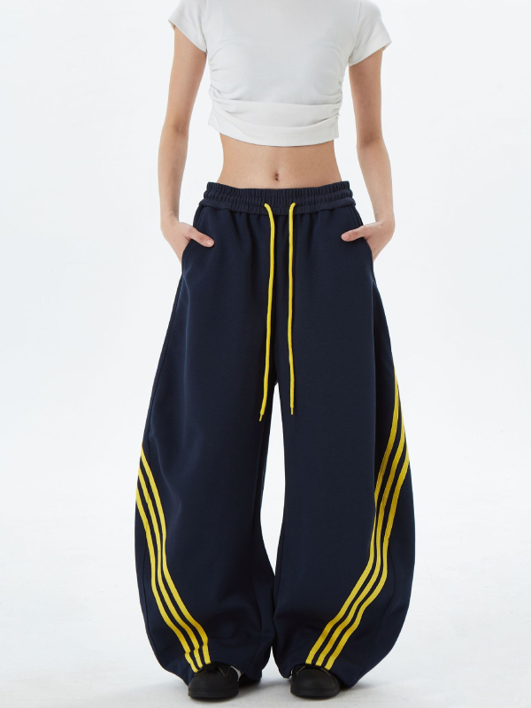 Američki gradski stil: široke sportske hlače s prugama i blokovima boja, unisex, retro dizajn, s vrpcom u struku i opuštenim krojem