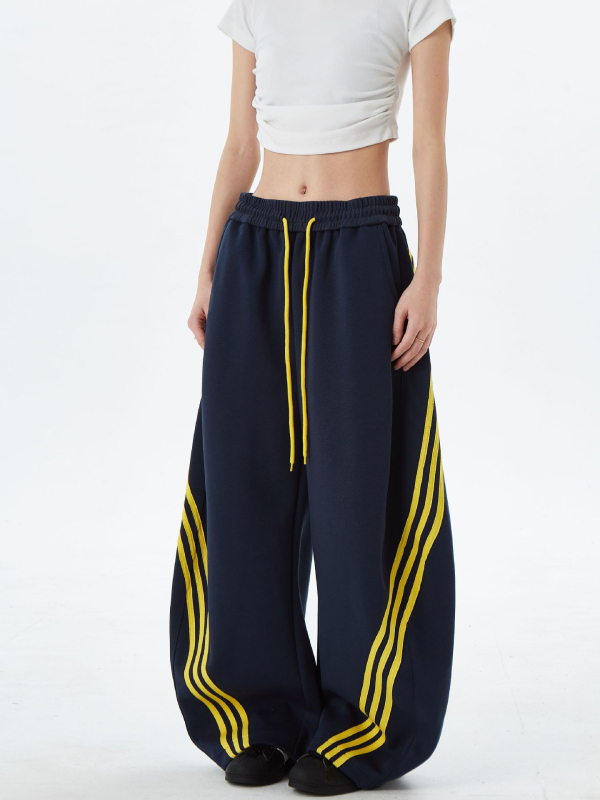 Američki gradski stil: široke sportske hlače s prugama i blokovima boja, unisex, retro dizajn, s vrpcom u struku i opuštenim krojem