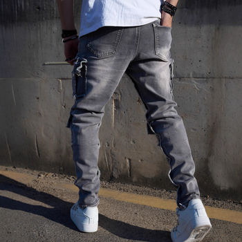 Teške retro radničke traperice s višestrukim džepovima, opušten kroj ravnih nogavica, plave denim hlače za muškarce