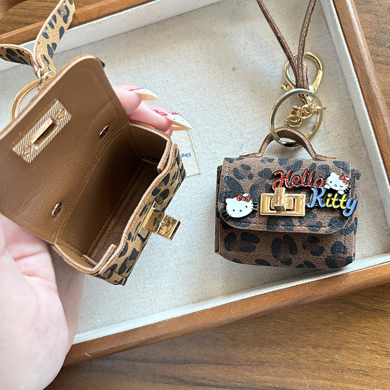 Jesen-zimski novi kreativni retro leopard uzorak s mačjim ušima, privjesak za torbu i slušalice, moderan teen dodatak