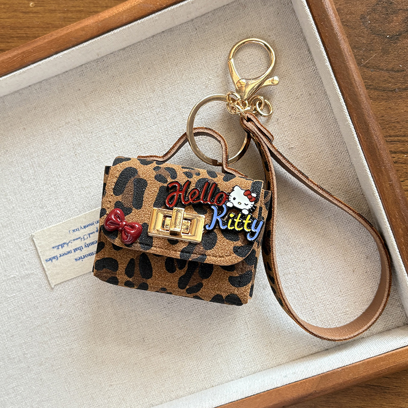 Jesen-zimski novi kreativni retro leopard uzorak s mačjim ušima, privjesak za torbu i slušalice, moderan teen dodatak