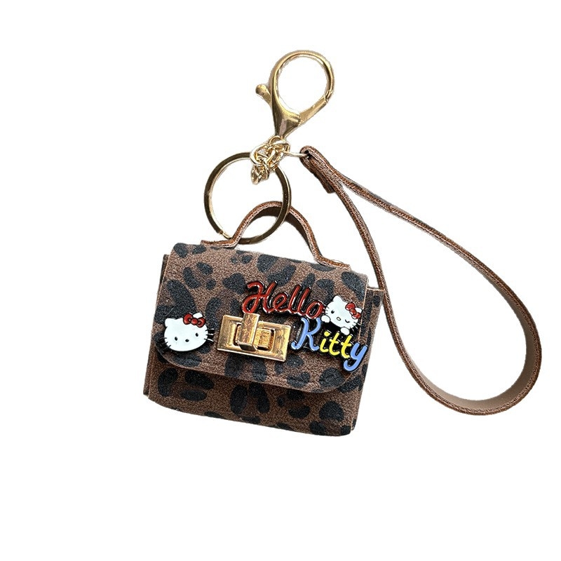 Jesen-zimski novi kreativni retro leopard uzorak s mačjim ušima, privjesak za torbu i slušalice, moderan teen dodatak