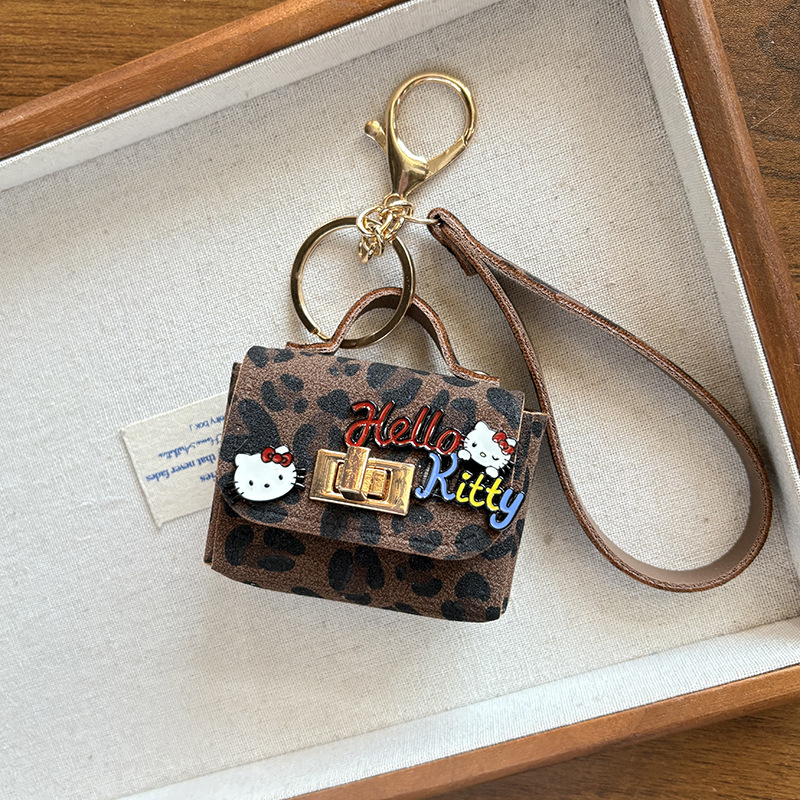 Jesen-zimski novi kreativni retro leopard uzorak s mačjim ušima, privjesak za torbu i slušalice, moderan teen dodatak