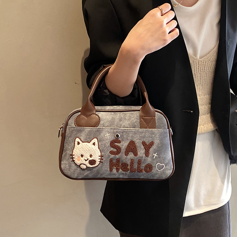 Ženska torbica s mat alfabetnim motívom, velika kapaciteta, za rame ili crossbody, novi model 2025, motiv mačke iz crtića