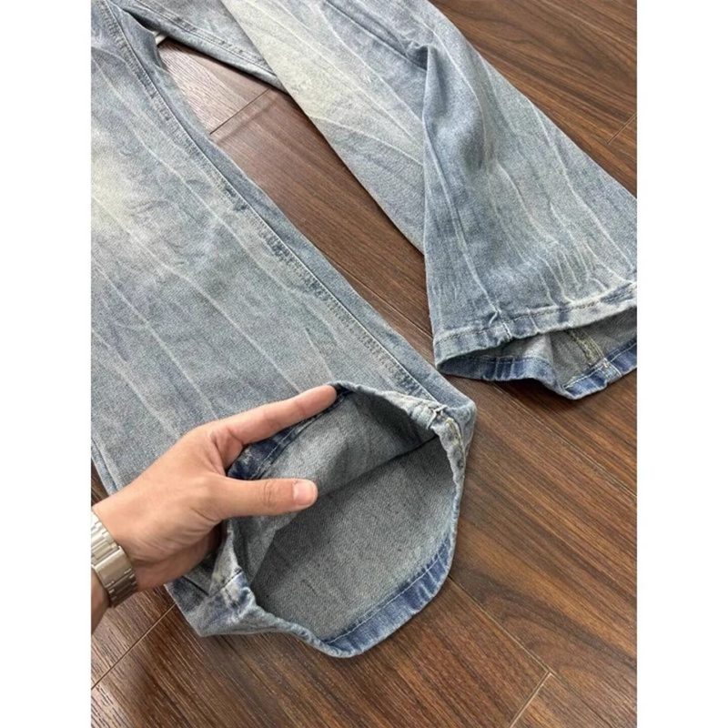 Muške traperice Cleanfit u američkom street stilu, isprani denim s oštećenjima, crno-sive, ravnog kroja s blagim širim donjim dijelom