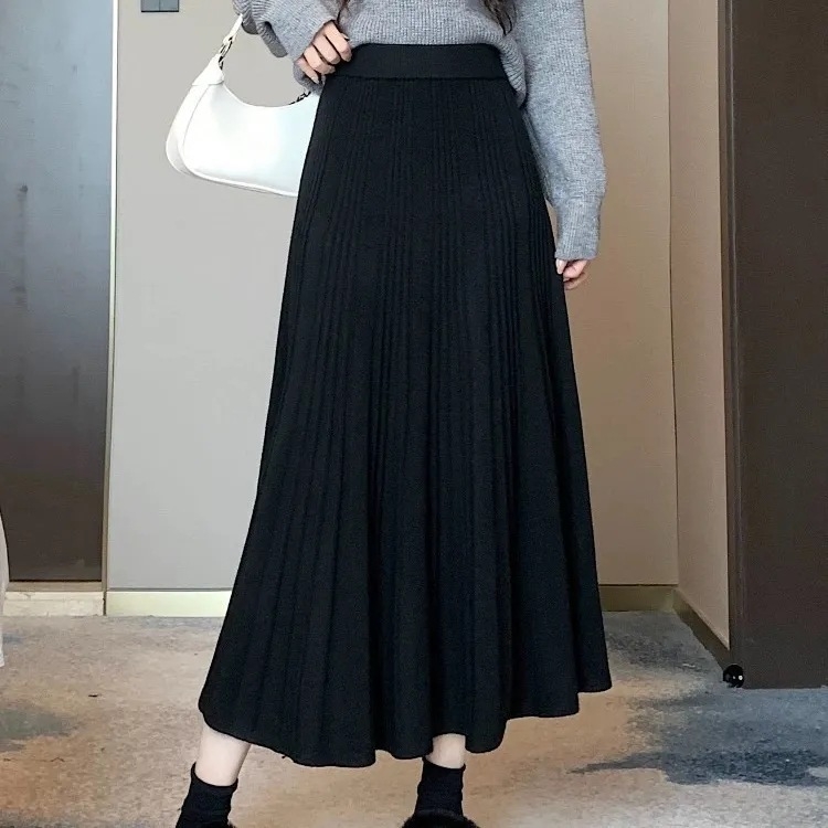 Ženska pletena suknja za jesen i zimu, opuštenog kroja, vizualno oblikuje figuru, plisirana, casual stil, srednja duljina, široki rub.