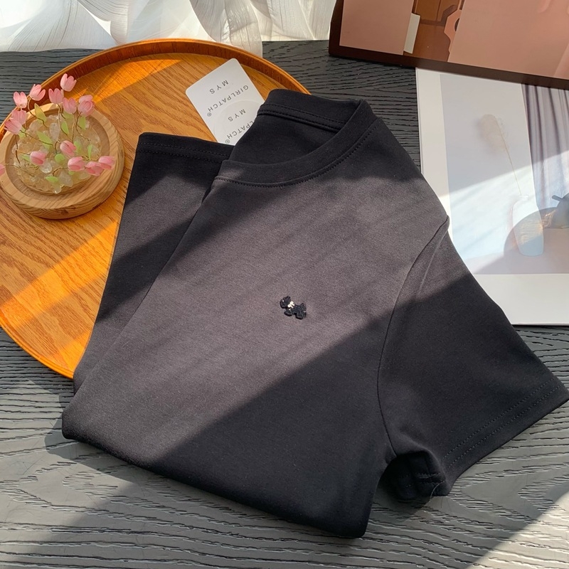 Ženski bijeli T‑shirt kratkih rukava s okruglim izrezom, uski kroj, smjesa poliester, minimalistički stil, ljeto 2026
