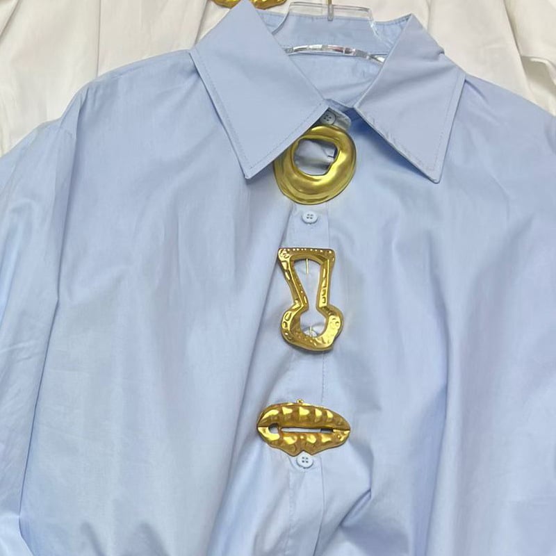 Ženska bluza s dugim rukavima, polo ovratnik, slobodan kroj, jednobojna, poliester.