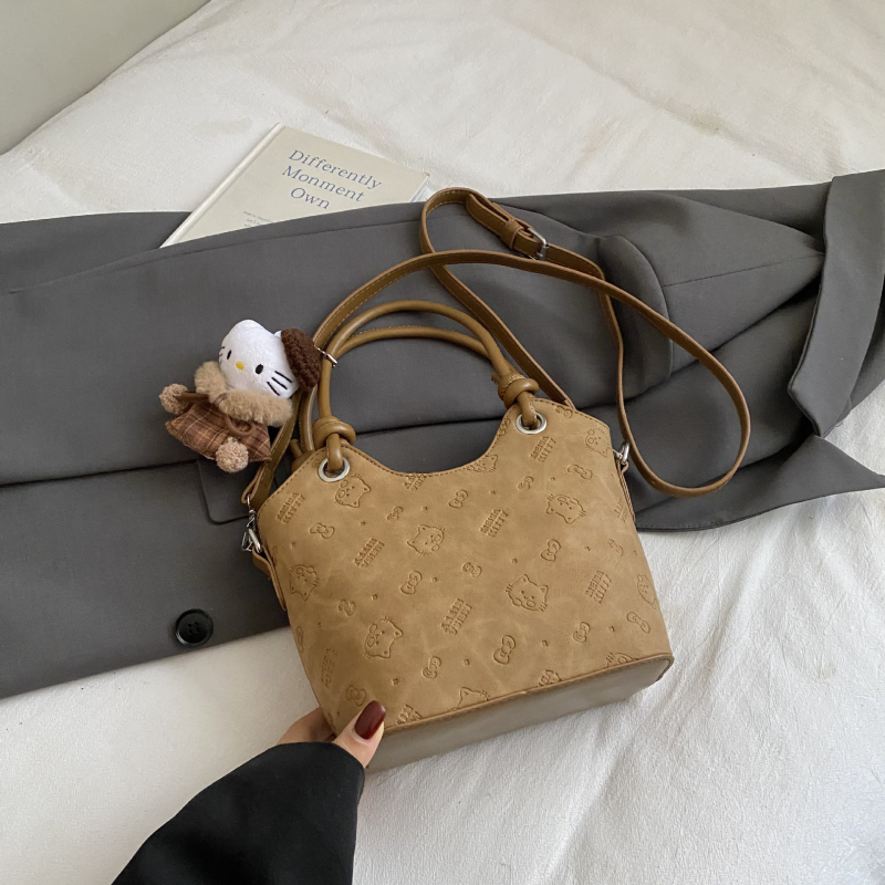 Ženska bucket torba s reljefom, vintage stil, elegantan i minimalistički dizajn, za rameni ili crossbody, izdanje 2025