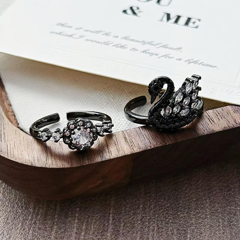 Unisex bakreni prsten s motivima zvijezde i labud, crni završni premaz, stackable dizajn, cirkon