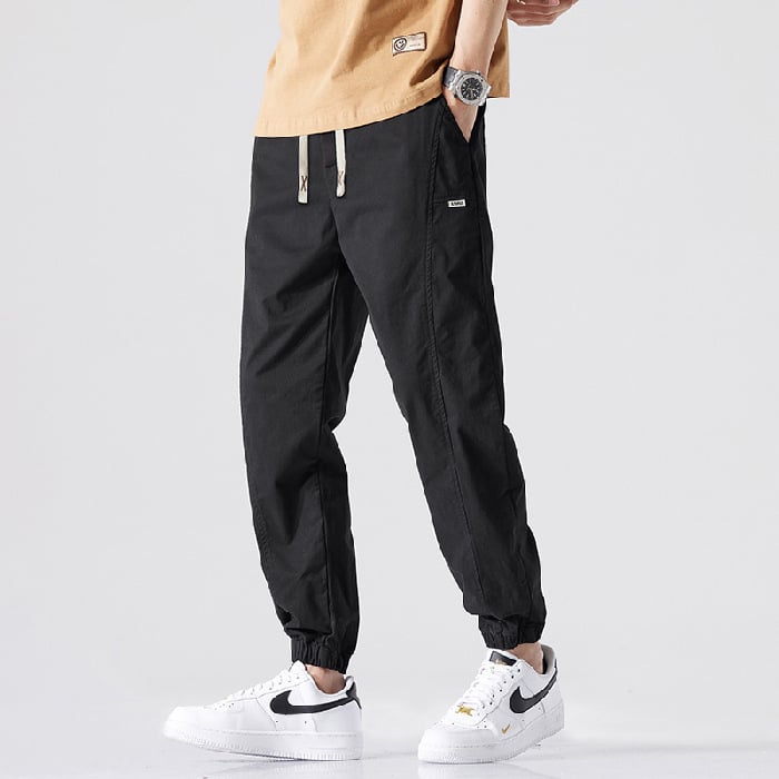 Férfiaknak: elasztikus derekú jogger nadrág, laza szabású, hosszú casual nadrág húzózsinórral, hip-hop stílus