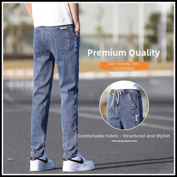 Őszi férfi farmernadrág elasztikus derékkal, karcsúsított szabás, enyhén szűkített egyenes szár, mosott denim