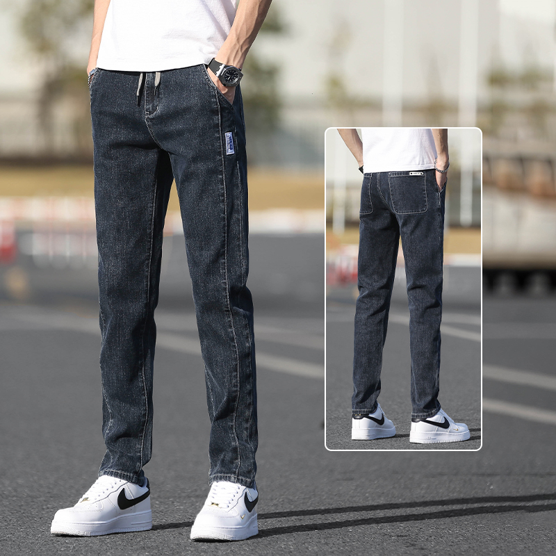 Őszi férfi farmernadrág elasztikus derékkal, karcsúsított szabás, enyhén szűkített egyenes szár, mosott denim