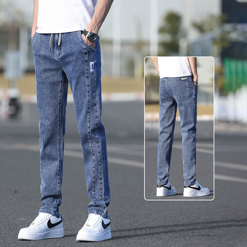 Őszi férfi farmernadrág elasztikus derékkal, karcsúsított szabás, enyhén szűkített egyenes szár, mosott denim