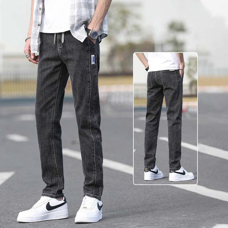 Őszi férfi farmernadrág elasztikus derékkal, karcsúsított szabás, enyhén szűkített egyenes szár, mosott denim