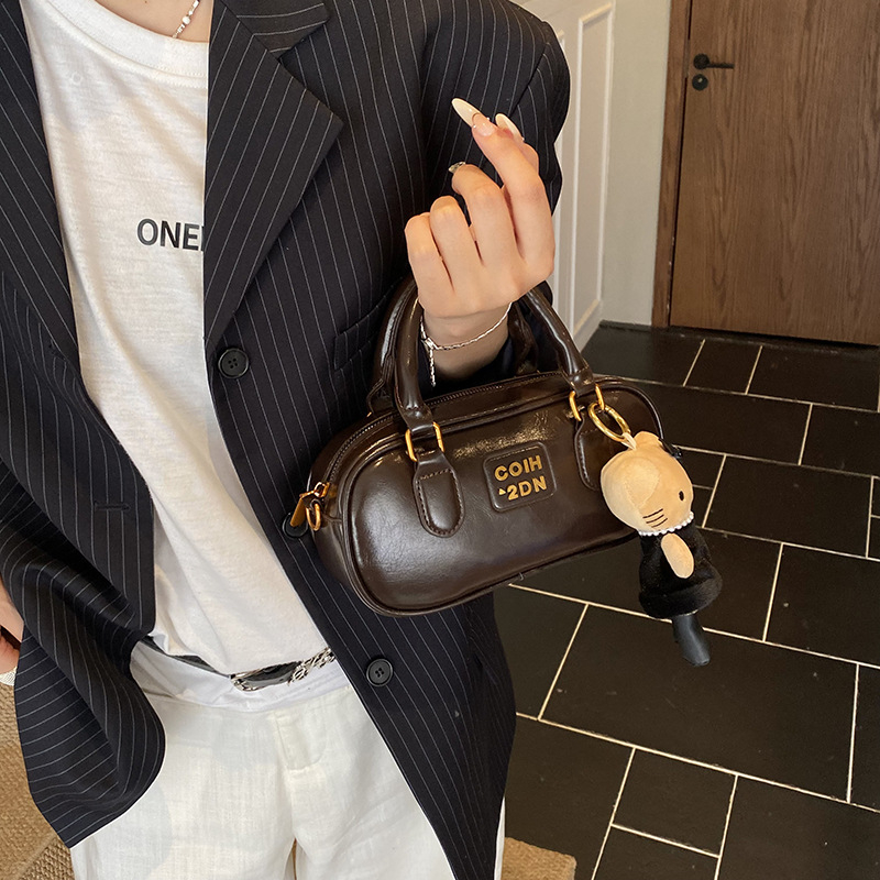 2025 jesen-zima nova korejska nišna retro bowling torba za žene, casual modni model preko ramena i crossbody