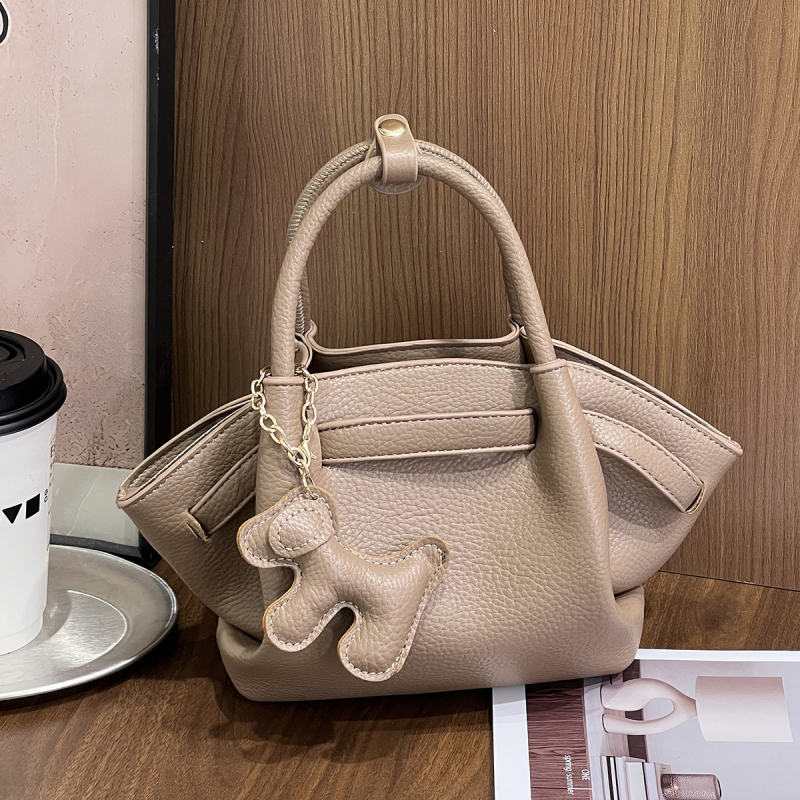 Ženska crossbody torbica, svestran minimalistički dizajn, mala kvadratna dumpling torbica, proljeće 2025