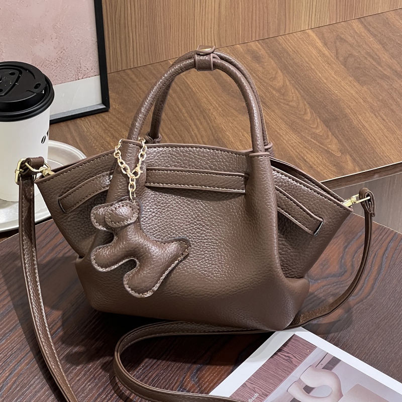 Ženska crossbody torbica, svestran minimalistički dizajn, mala kvadratna dumpling torbica, proljeće 2025