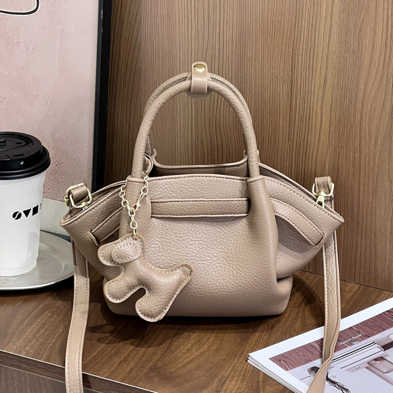 Ženska crossbody torbica, svestran minimalistički dizajn, mala kvadratna dumpling torbica, proljeće 2025