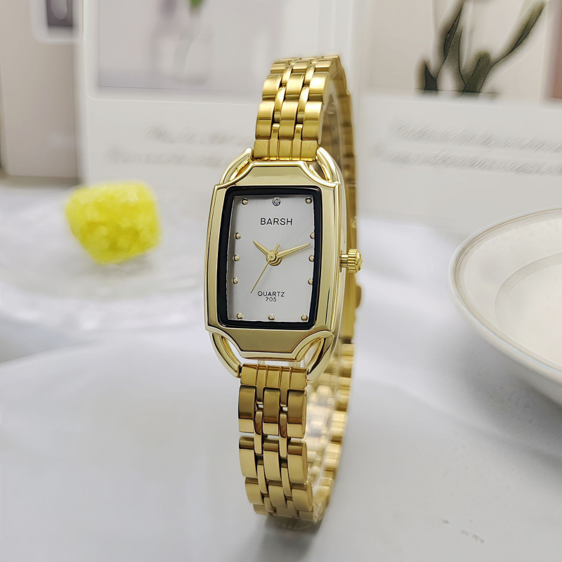 Ženski sat u zlatnom tonu, kvarc, pravokutno-metalno kućište, brojčanik 24 mm, debljina 7 mm, metalna narukvica, klasičan elegantan stil