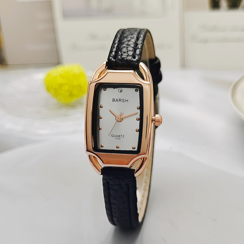 Ženski sat u zlatnom tonu, kvarc, pravokutno-metalno kućište, brojčanik 24 mm, debljina 7 mm, metalna narukvica, klasičan elegantan stil