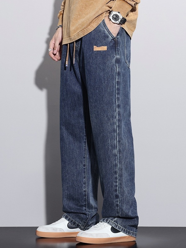 Férfiaknak szánt amerikai workwear stílusú farmerok, új tavasz–ősz modell, elasztikus derék, laza szabás, egyenes szárú, széles szárú, padlóig érő.