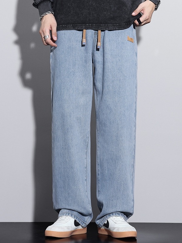 Férfiaknak szánt amerikai workwear stílusú farmerok, új tavasz–ősz modell, elasztikus derék, laza szabás, egyenes szárú, széles szárú, padlóig érő.