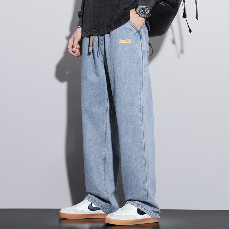 Férfiaknak szánt amerikai workwear stílusú farmerok, új tavasz–ősz modell, elasztikus derék, laza szabás, egyenes szárú, széles szárú, padlóig érő.