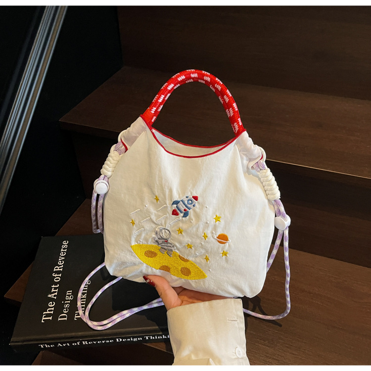 Ženska moderna mini crossbody torba u jednobojnoj boji s izvezenim cartoon motivom – praktična svakodnevna torba preko ramena s pretincem za telefon