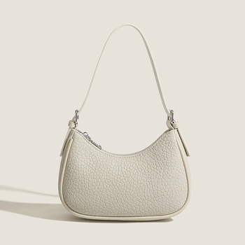 2026 Nova modna minimalistička torba za podlakticu s dojmljivim dojmom vrhunske kvalitete, bijela baguette torba, svestrana za rame ili crossbody.