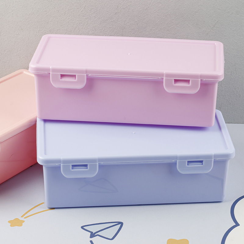 Bijela prozirna pravokutna kutija za pohranu s podiznim poklopcem za olovke i uredsku organizaciju, dimenzije 18,5 × 6 × 9 cm