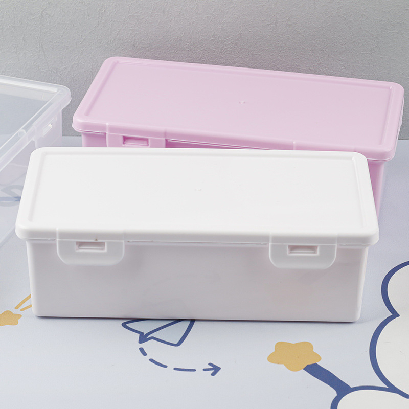 Bijela prozirna pravokutna kutija za pohranu s podiznim poklopcem za olovke i uredsku organizaciju, dimenzije 18,5 × 6 × 9 cm