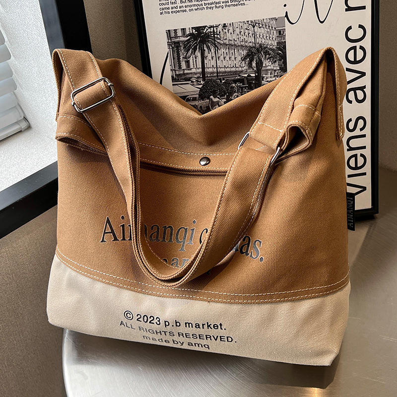Ženska platnena torba s velikim kapacitetom, novi model 2026, crossbody torba s kontrastnim blokovima boja, svakodnevna tote torba, korejski ulićni stil