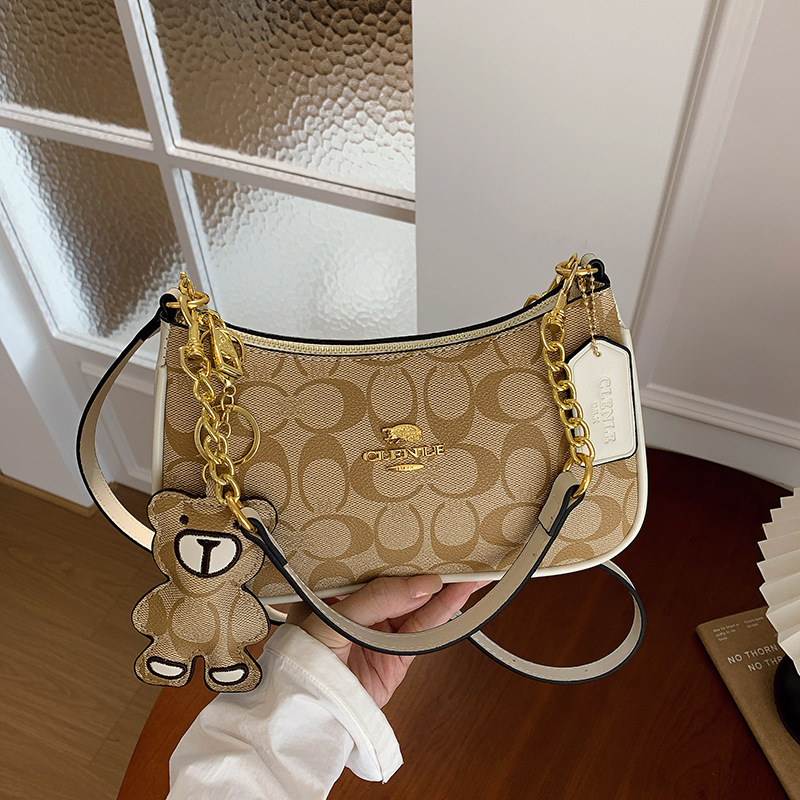 Ženska visoke kvalitete kvadratna crossbody torba, 2026 novi stil, elegantan i moderan retro dojam