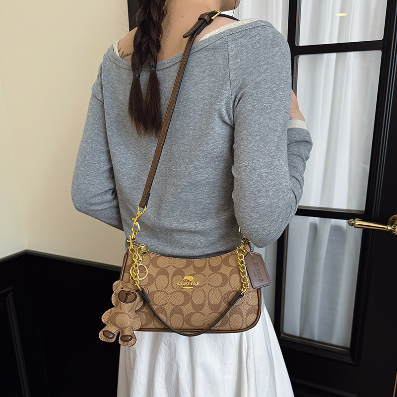 Ženska visoke kvalitete kvadratna crossbody torba, 2026 novi stil, elegantan i moderan retro dojam