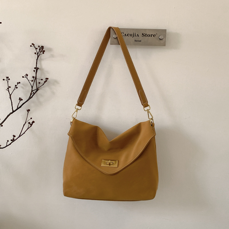 Ženska crossbody torbica visokokvalitetna, inspirirana vintage stilom 2026, svestrana i teksturirana za svakodnevnu upotrebu