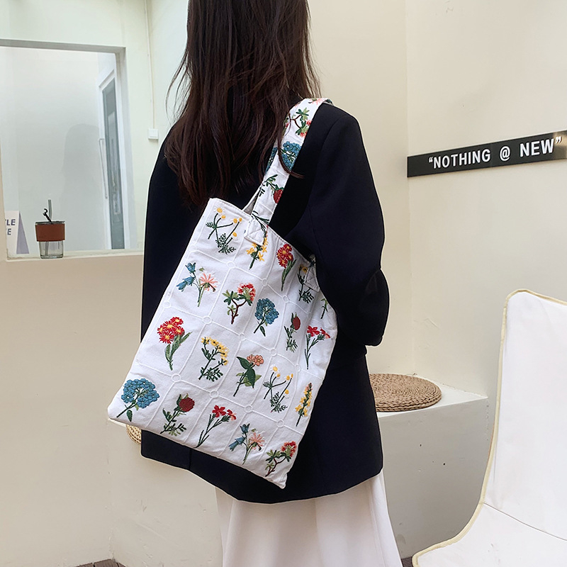 Platnena torbica za djevojčice s izvezenim cvjetnim motivom, lagana i moderna crossbody torba