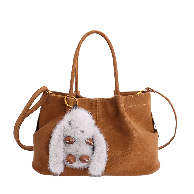Ženska torba u retro stilu za svakodnevnu uporabu, novi model 2025, minimalist tote, s ramenskim i crossbody remenom.
