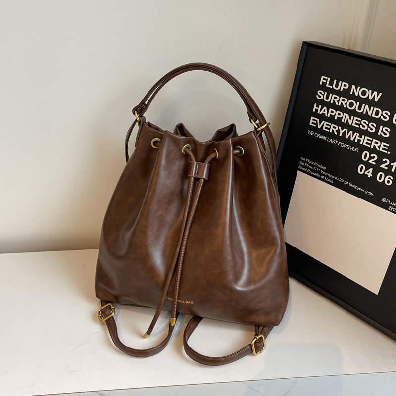 Retro stil bucket torba s crossbody remenom, velika zapremina za žene, novi model 2025, moderni i svestrani za rame ili ruksak