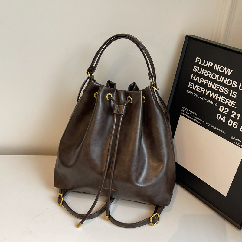 Retro stil bucket torba s crossbody remenom, velika zapremina za žene, novi model 2025, moderni i svestrani za rame ili ruksak