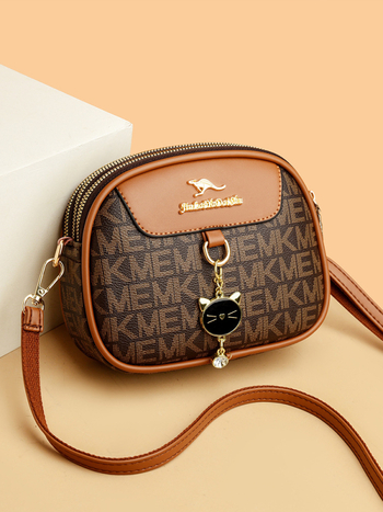 Ženska mala okrugla crossbody torba, mekana koža