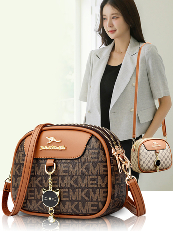 Ženska mala okrugla crossbody torba, mekana koža