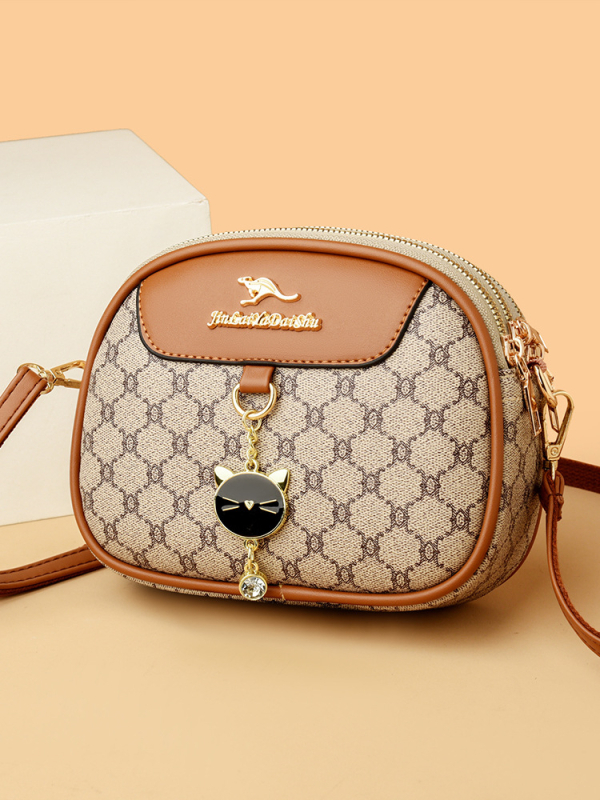 Ženska mala okrugla crossbody torba, mekana koža