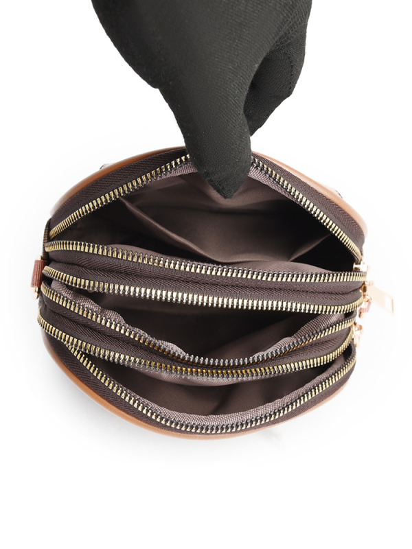 Ženska mala okrugla crossbody torba, mekana koža