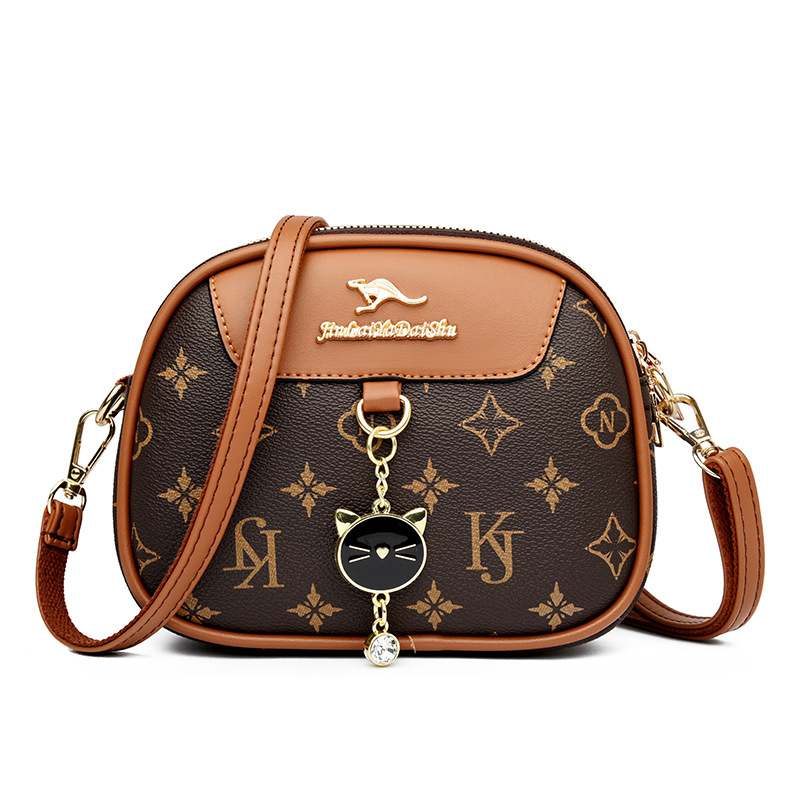Ženska mala okrugla crossbody torba, mekana koža