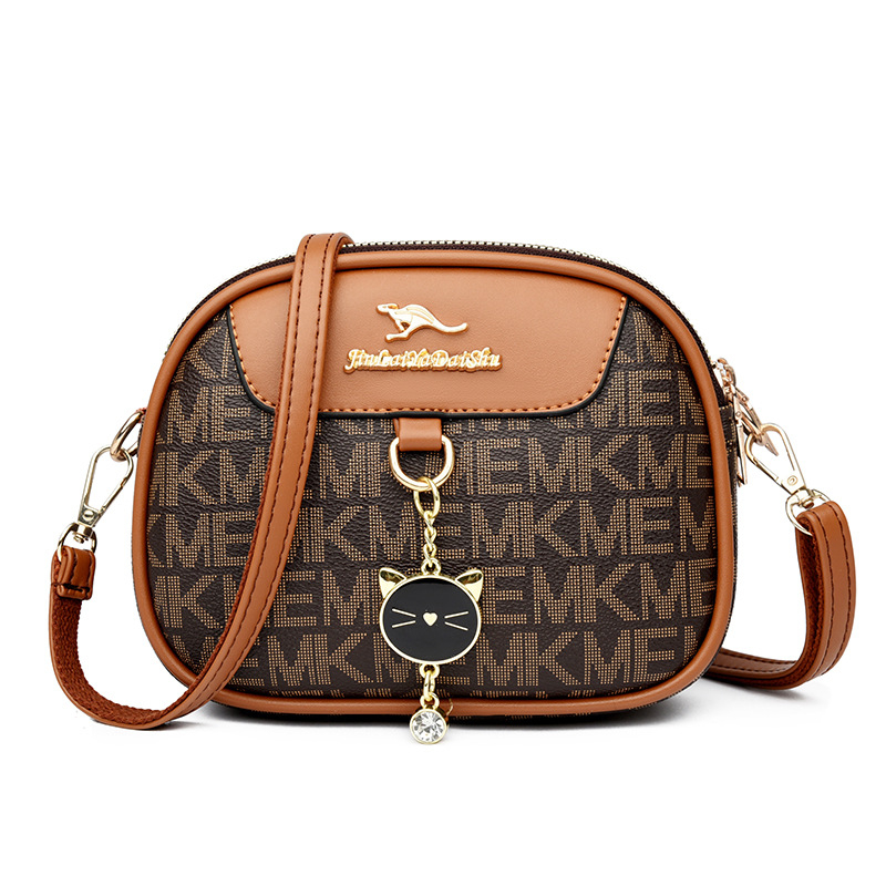 Ženska mala okrugla crossbody torba, mekana koža